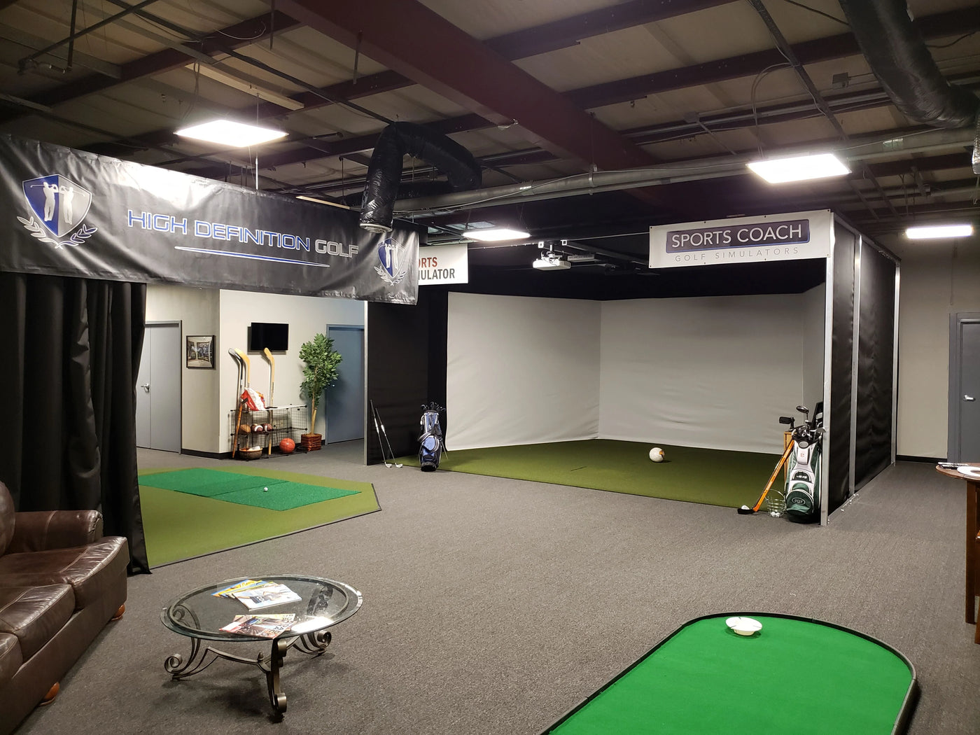Multiple Golf Simulator Image with green in a store 