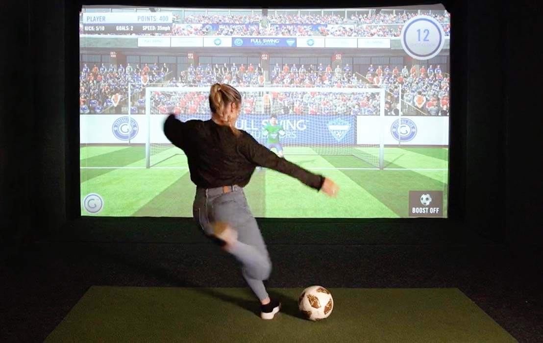 Girl kicking soccer ball Full swing Sports Simulator