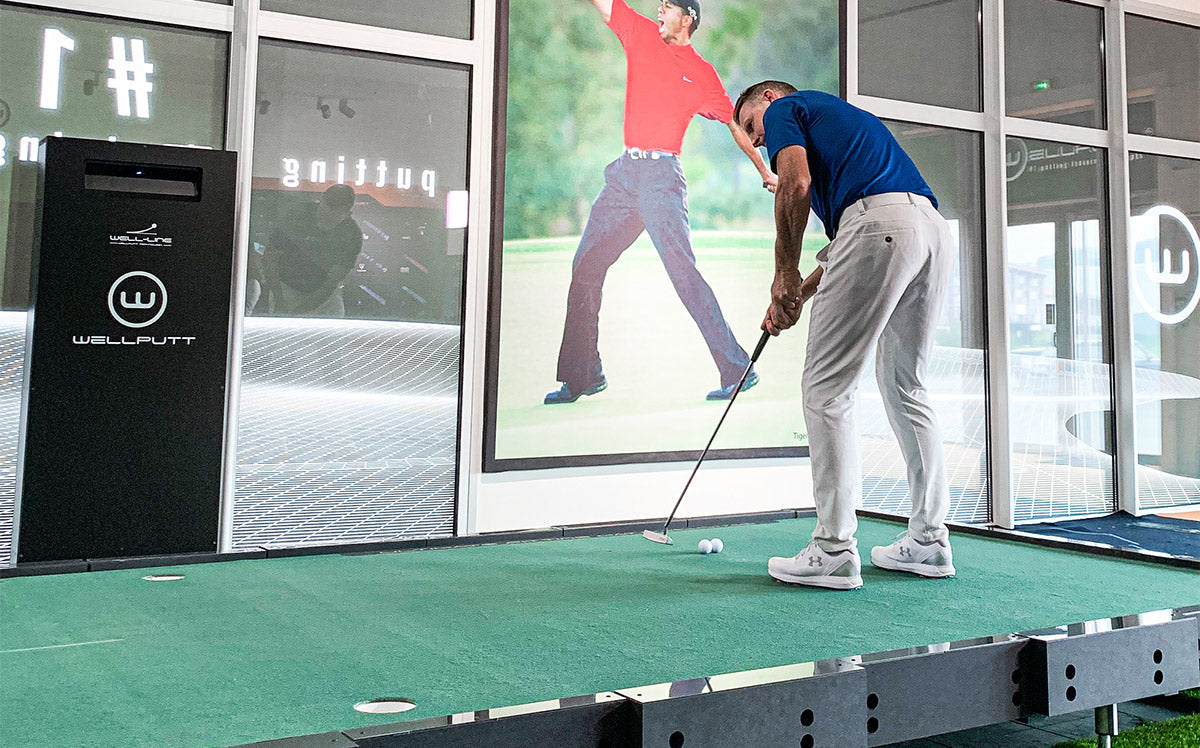 Golfer using Big Tile putting platform