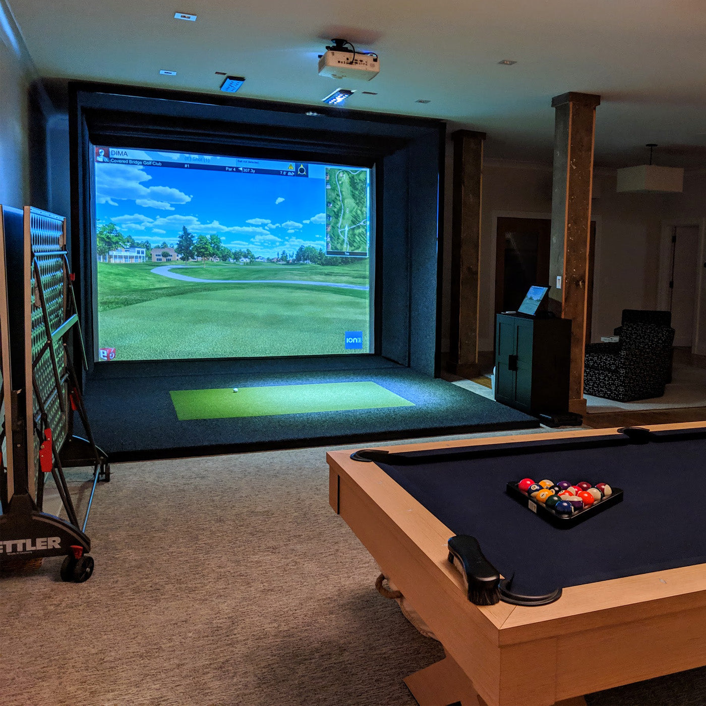 golf simulator running golf simulation in basement