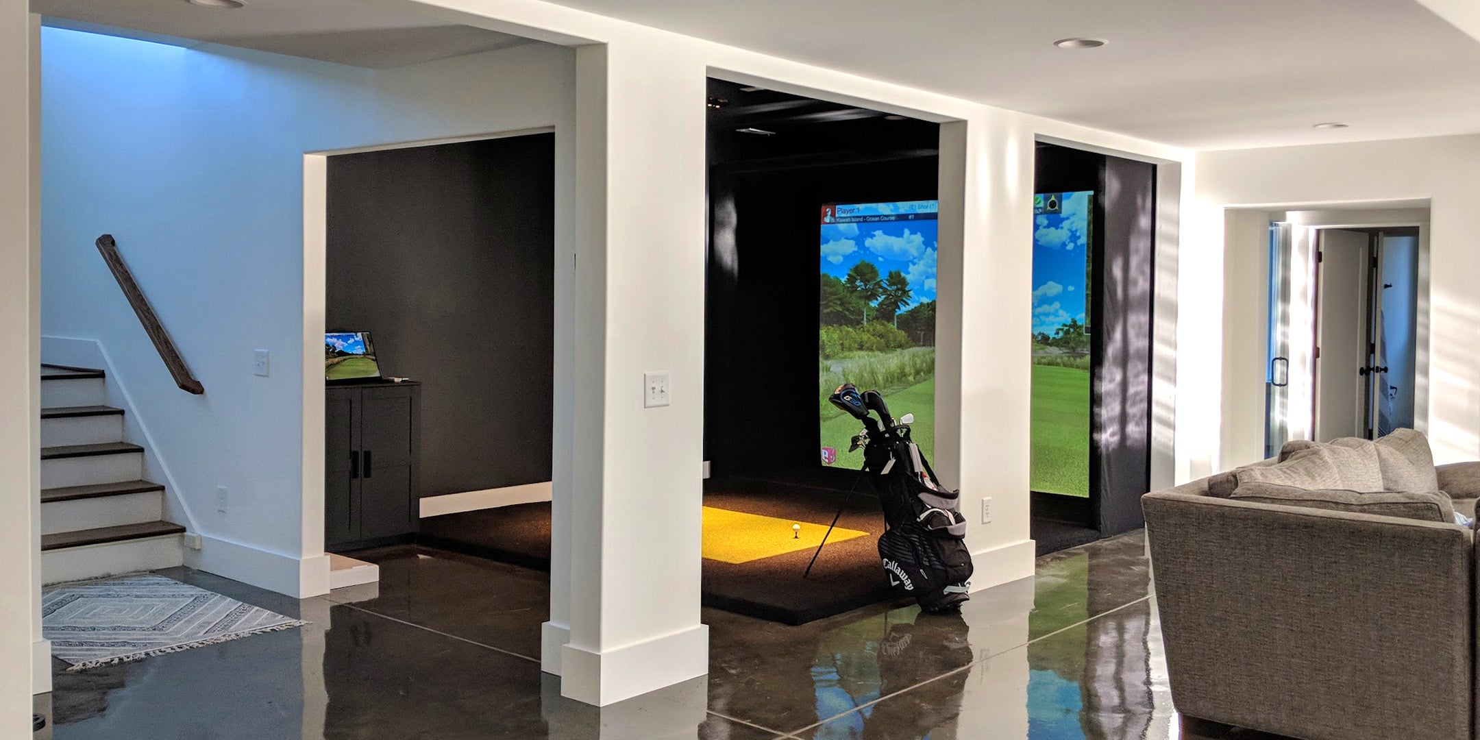 golf simulator in home basement running golf simulation